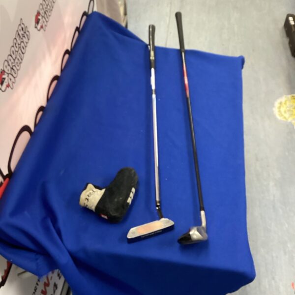 Golf club set featuring Wilson C1-12 putter and Nike hybrid wood.