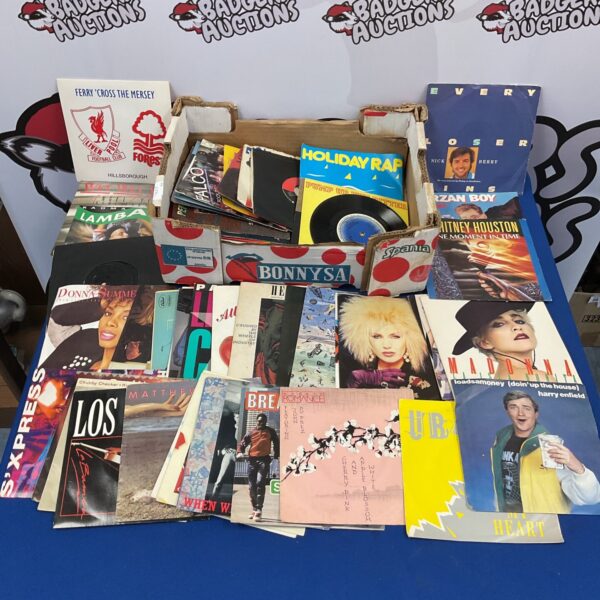 Vintage 1980s vinyl single record collection for music enthusiasts.