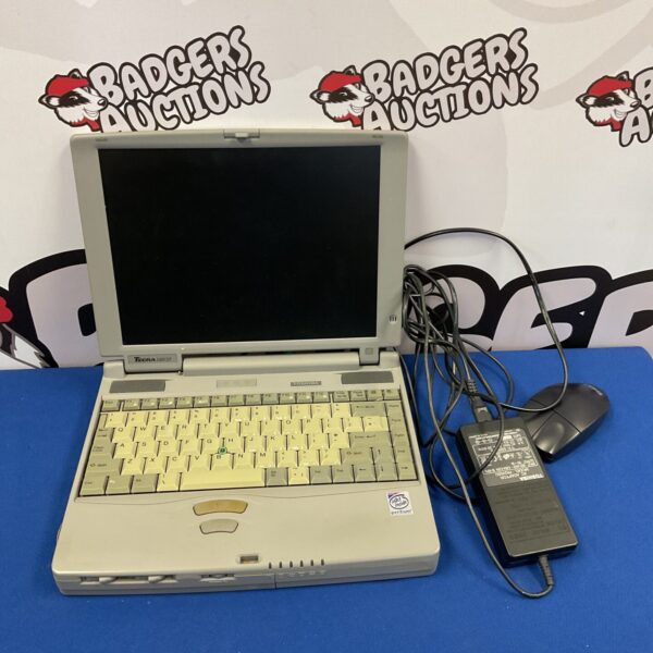 Vintage Toshiba Tecra 530CDT laptop with power adapter.