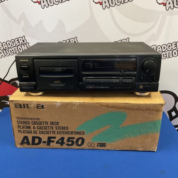 Vintage Aiwa AD-F450 cassette deck in black, side view.