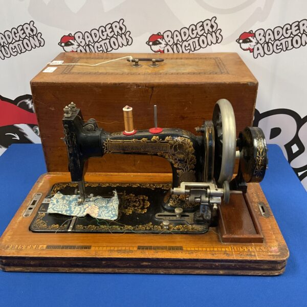 Antique Frister & Rossman hand crank sewing machine, vintage collectible.