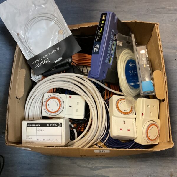 Mixed lot of socket timers and a Linksys router for home use.