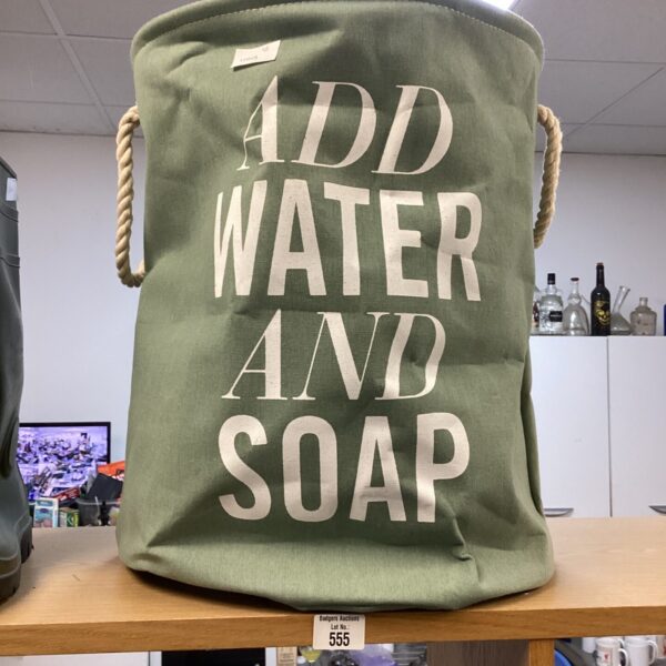 Vintage canvas wash bin with "ADD WATER AND SOAP" lettering.