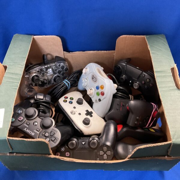Mixed lot of gaming controllers including Nintendo Switch and PS3.
