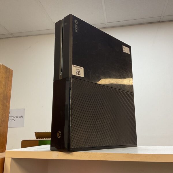 Black Microsoft Xbox One gaming console for sale.