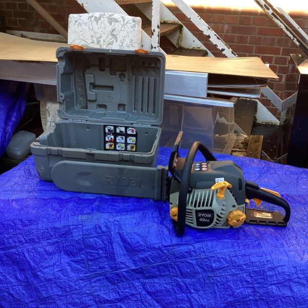 Ryobi petrol chainsaw in its original carrying case, garden tool.