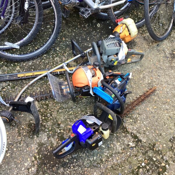 Job lot of petrol garden tools including a hedge trimmer and chainsaw.