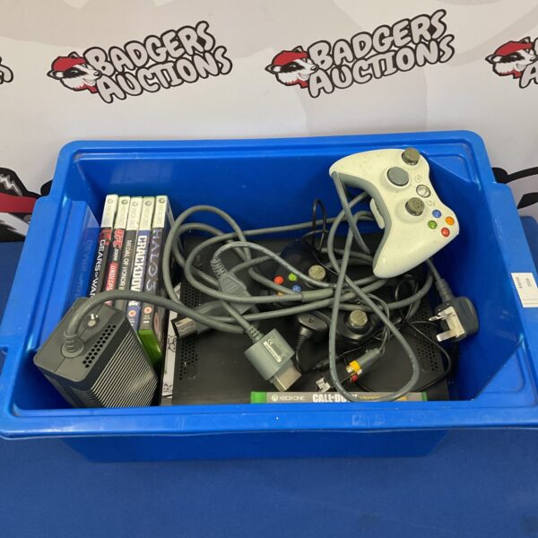 Microsoft Xbox 360 console with games and controllers presented.