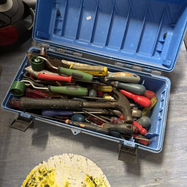 Blue plastic toolbox filled with a variety of hand tools.