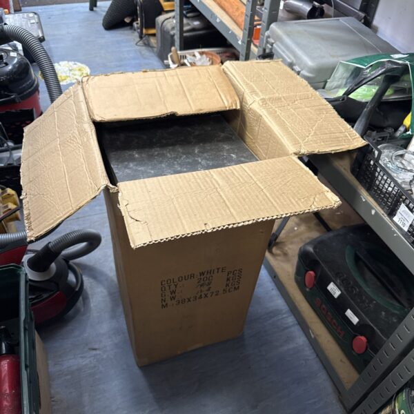 Cardboard box filled with a large quantity of lever arch files.