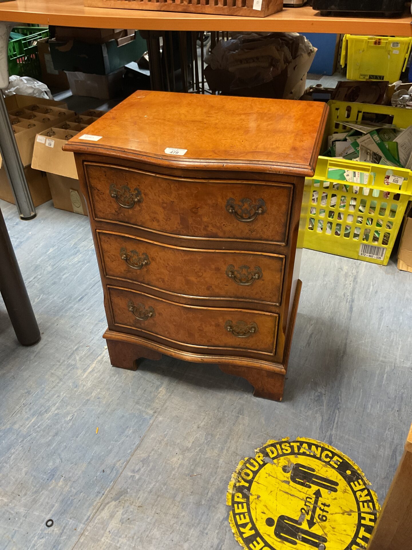 479 Burr walnut three draw brass handled bedside cabinet