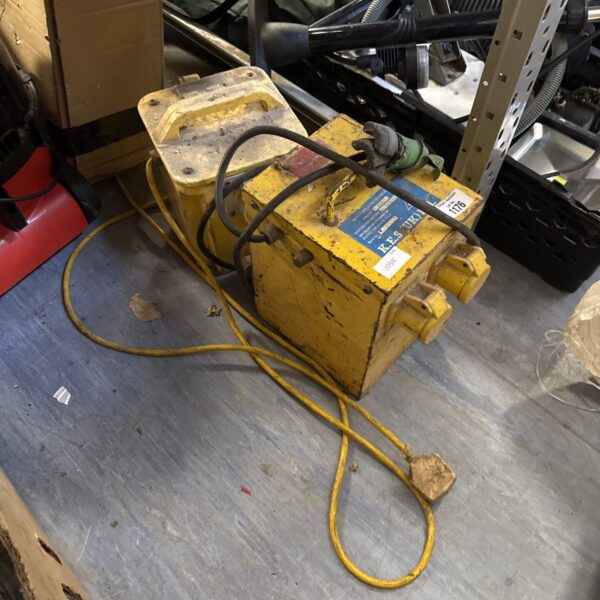Yellow 110v transformer block for industrial power conversion.