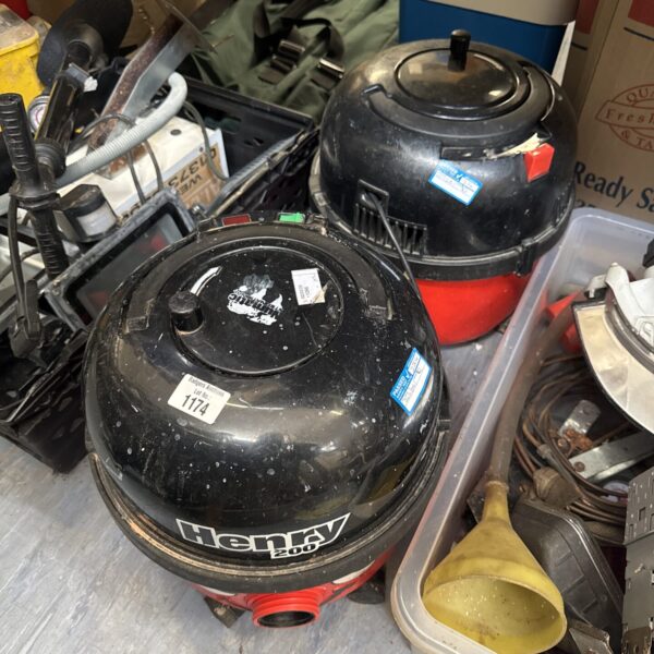 Two red and black Numatic Henry Hoover bodies for parts or restoration.