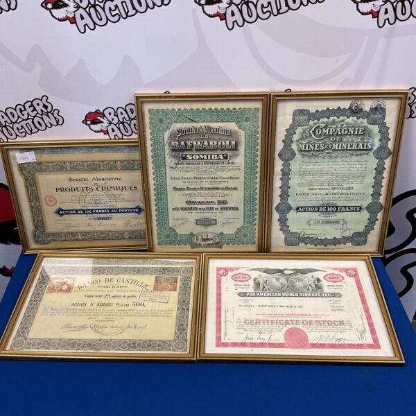 Framed collection of vintage bond certificates, including Pan American Airways.