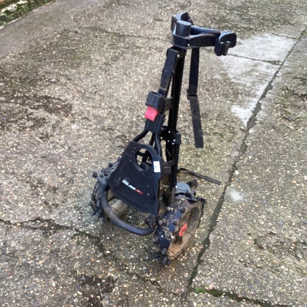 Black Series folding golf trolley for carrying equipment.