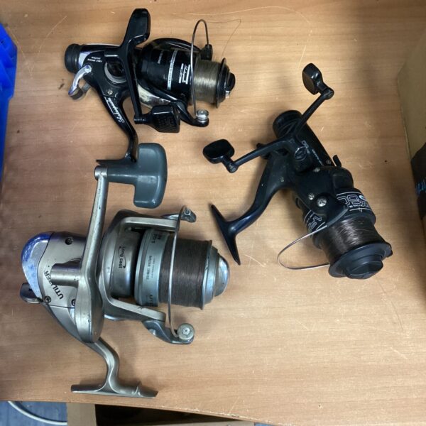 Vintage fixed spool fishing reels, classic angling equipment collection.