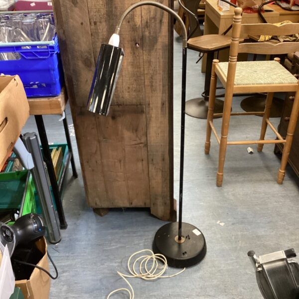 Vintage adjustable bankers lamp with black shade and heavy base.