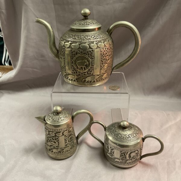 Vintage Indian silver teaset from 1946 with embossed details.