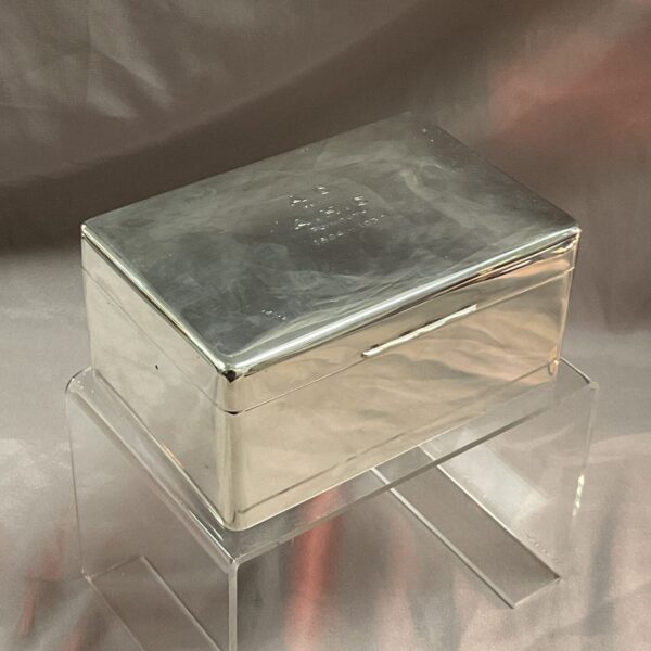 Edwardian silver cigarette box on a stand, vintage collectible.