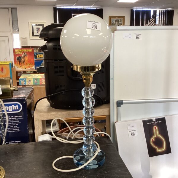 Vintage Art Deco table lamp with brass base and glass shade.