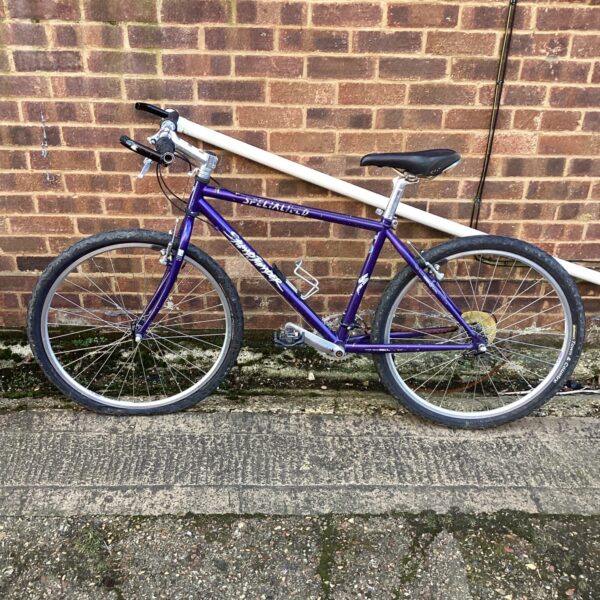 Vintage Specialized Stump Jumper mountain bike in purple.