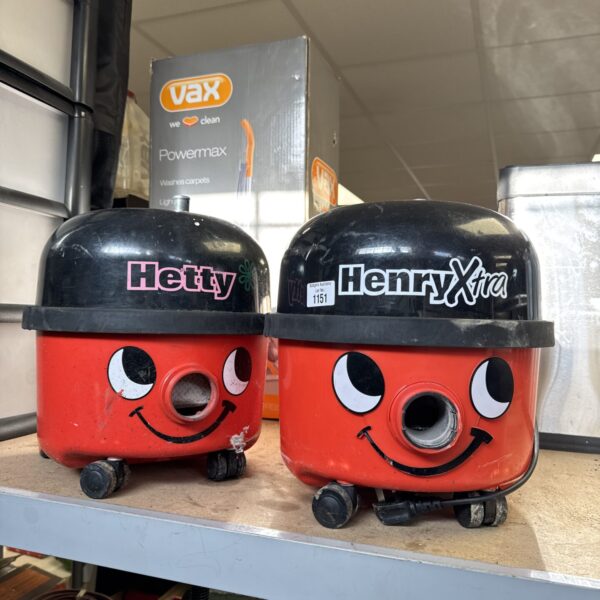 Red and purple Vax Henry & Hetty hoover bodies for restoration.