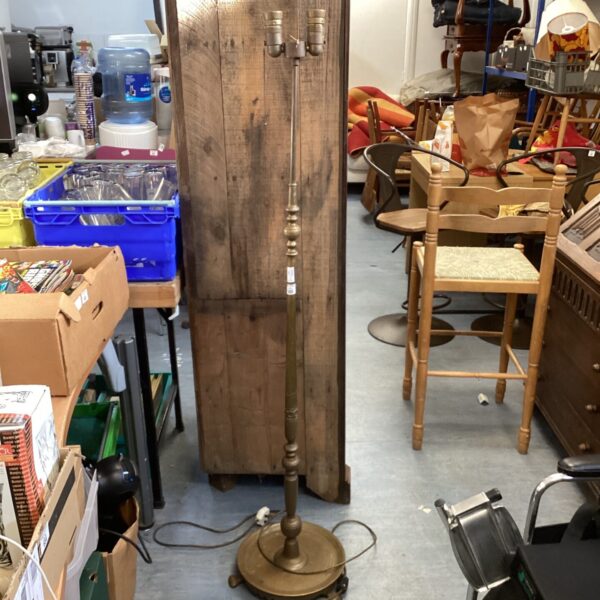 Antique brass floor lamp with a three-arm candelabra fixture.