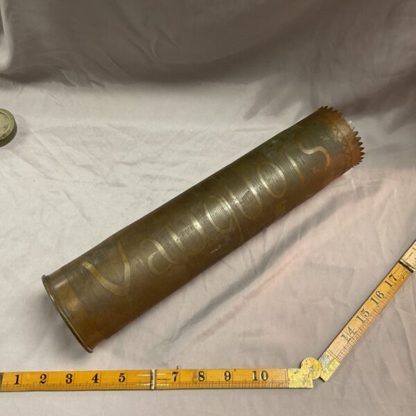 Intricate engraving on a WWI trench art shell casing.