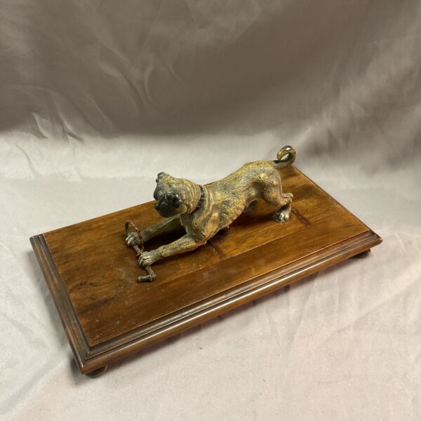 Antique Austrian bronze pug figurine on wooden base.