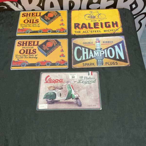 Reproduction vintage aluminium signs including Vespa, Shell and Raleigh branding.