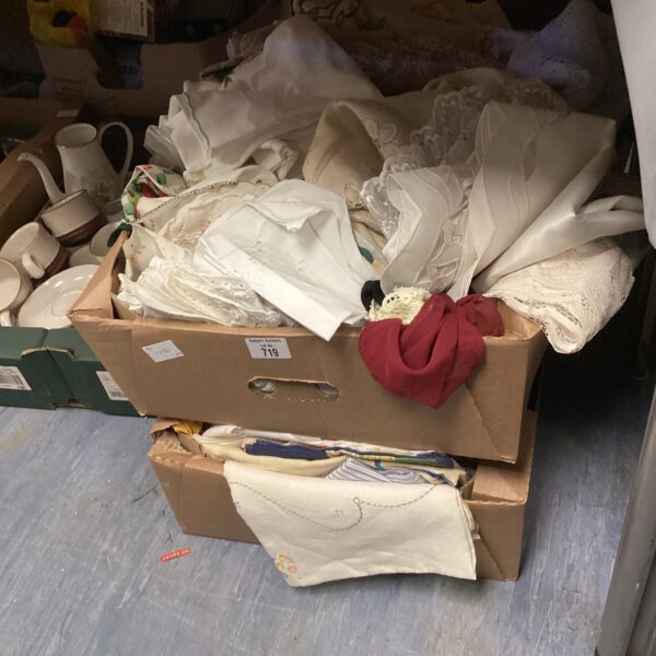 Assorted fabric lots in boxes, ideal for crafting projects.