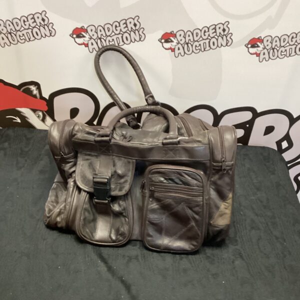 Brown vintage leather holdall, classic travel bag.