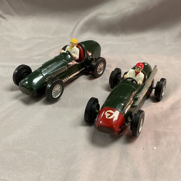 Vintage Scalextric Ferrari and Maserati slot cars, collectible tinplate toys.