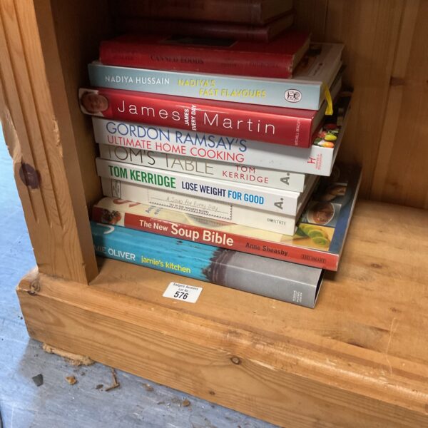 Stack of assorted cooking books for home cooking inspiration.