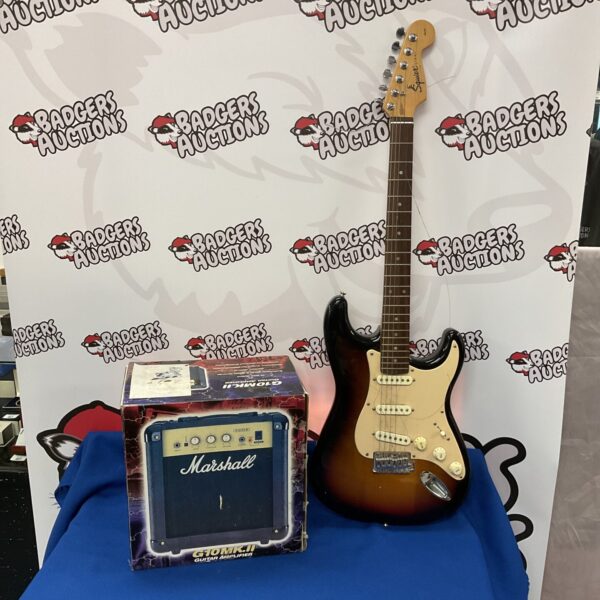 Squire Stratocaster electric guitar with Marshall amplifier setup.