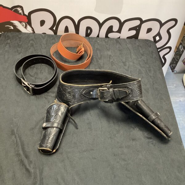 Vintage cowboy pistol holster with two new leather belts.