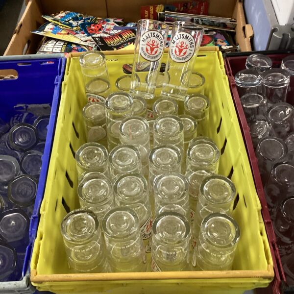 Stack of Maltsmiths branded pint glasses in a box.