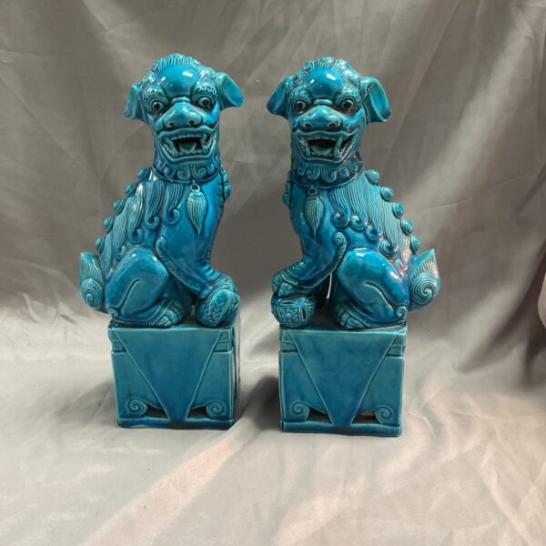 Antique Chinese Foo Dog statues, a vibrant blue pair.