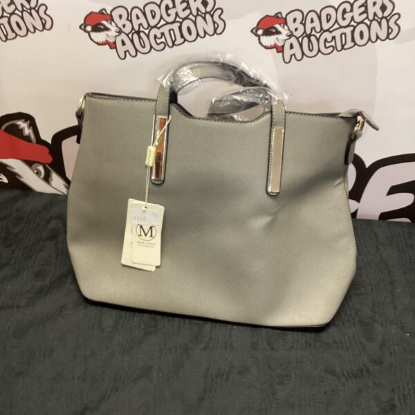 Pink Miss Lulu handbag with shoulder strap, stylish fashion accessory.
