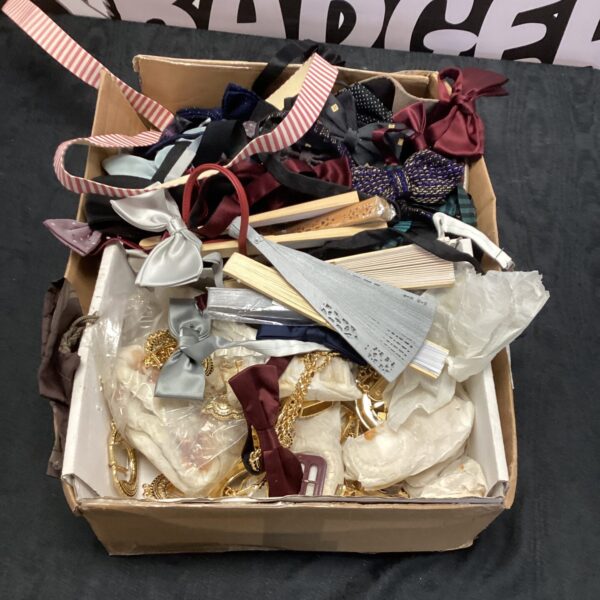 Vintage accessories lot featuring bow ties, belt buckles, and fans.