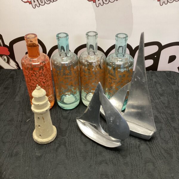 Assorted empty gin bottles and decorative collectibles on display.