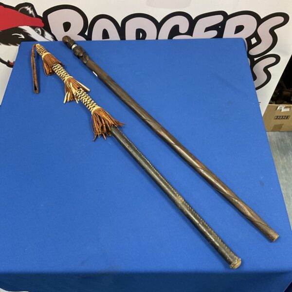 Two African shaman staffs with woven details.