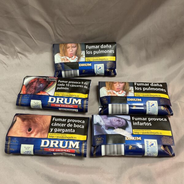 Close-up of sealed Drum Original tobacco pouch with health warning.