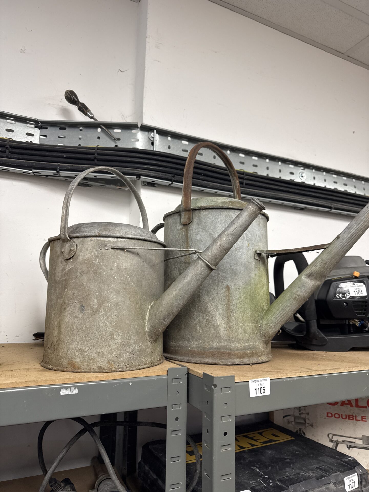 1105 Two vintage galvanised watering cans