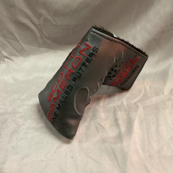 Black Scotty Cameron putter head cover for golf clubs.