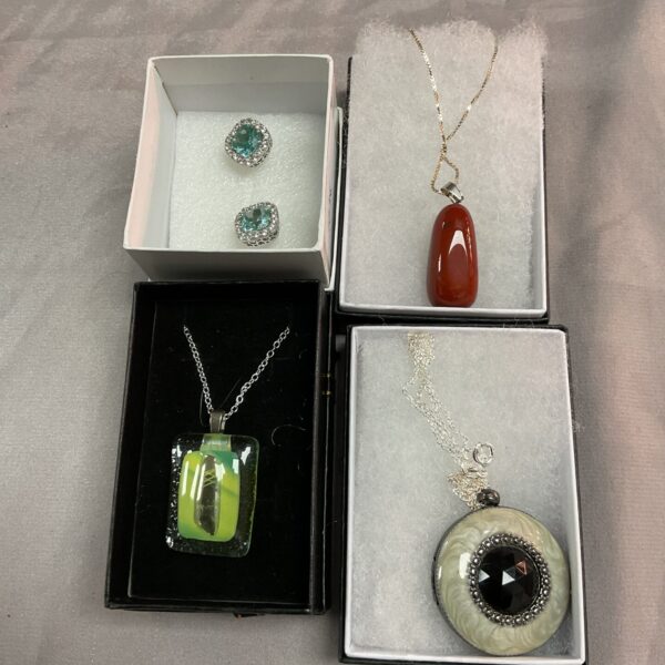 Silver stone necklace lot with green pendant.