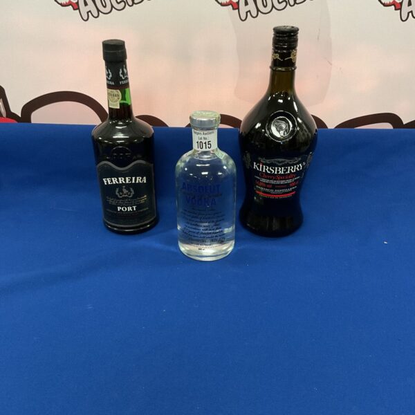 Sealed lot of alcohol bottles including Absolut Vodka and Ferreira Port.