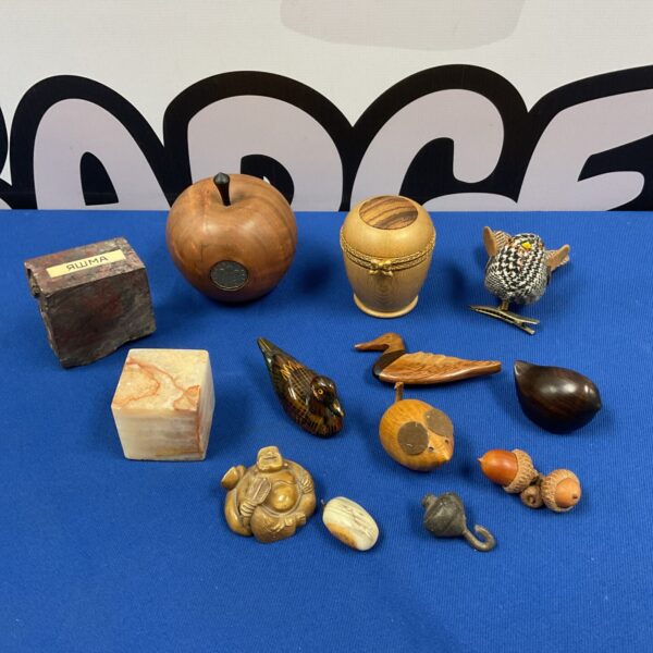 Vintage treen collection featuring miniature carved ducks and other folk art.