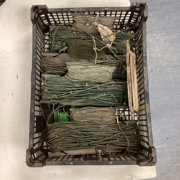 Crate of vintage electric wire for restoration projects.