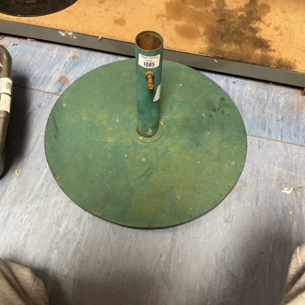 Vintage metal parasol base for garden or patio use.